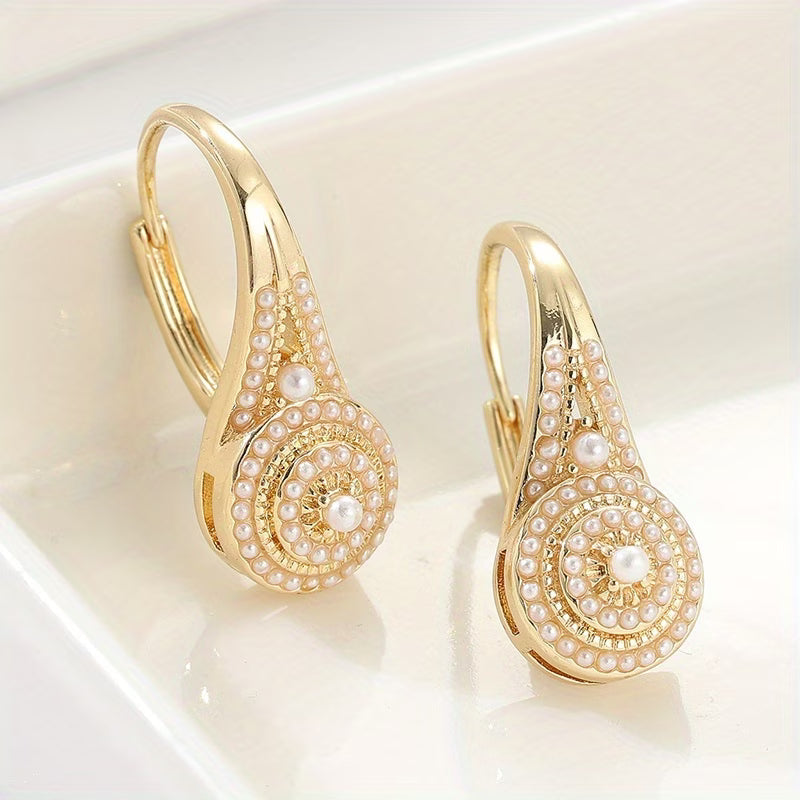 Boucles d'oreilles Danoir Paris Gilded Turquoise Bloom avec pendentifs en turquoise et détails dorés élégants.