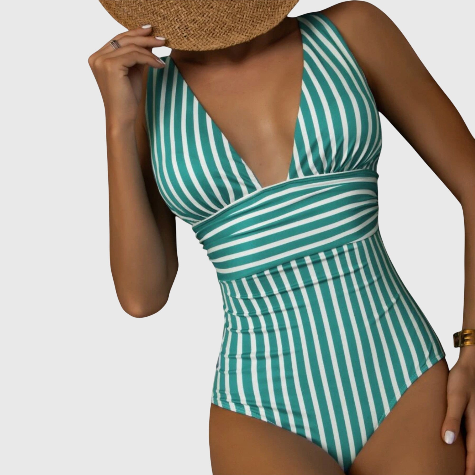 Maillot de bain turquoise Aurora de Danoir Paris, taille XS, avec détails élégants et coupe flatteuse, porté en situation balnéaire.