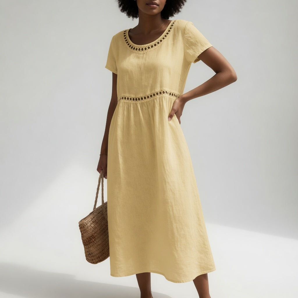 Robe mi-longue noire pour femme Pernelle™ en coton brodé, élégante et douce, vêtement féminin de Danoir Paris.