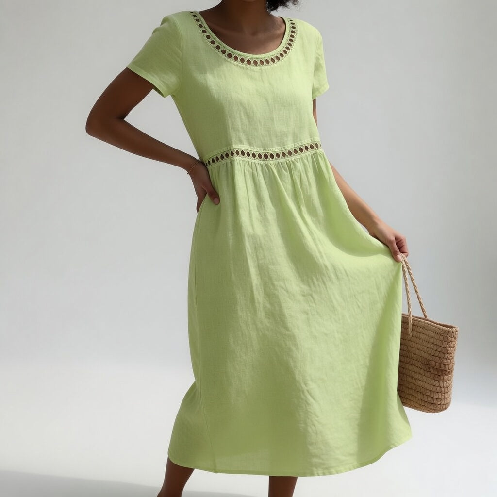 Robe mi-longue en coton brodé Pernelle™ pour femme, Danoir Paris, élégante et douce, couleur noire, détails brodés raffinés.