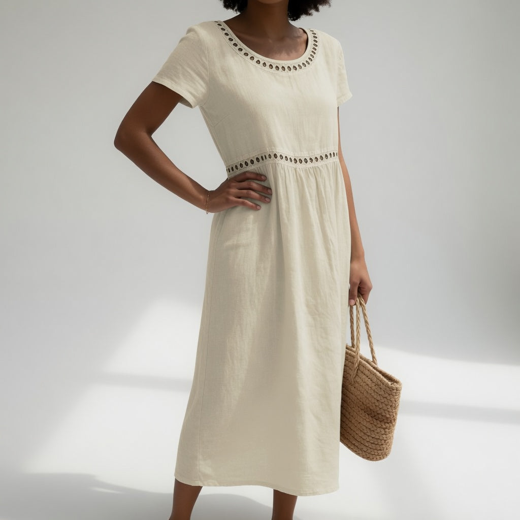 Robe mi-longue en coton brodé Pernelle™ pour femme, élégante et douce, noire, de la marque Danoir Paris.