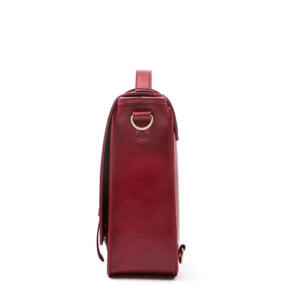 Sac rétro Knoten Twist en bleu-rose de Danoir Paris, sac à bandoulière en style vintage avec design unique et coloré.