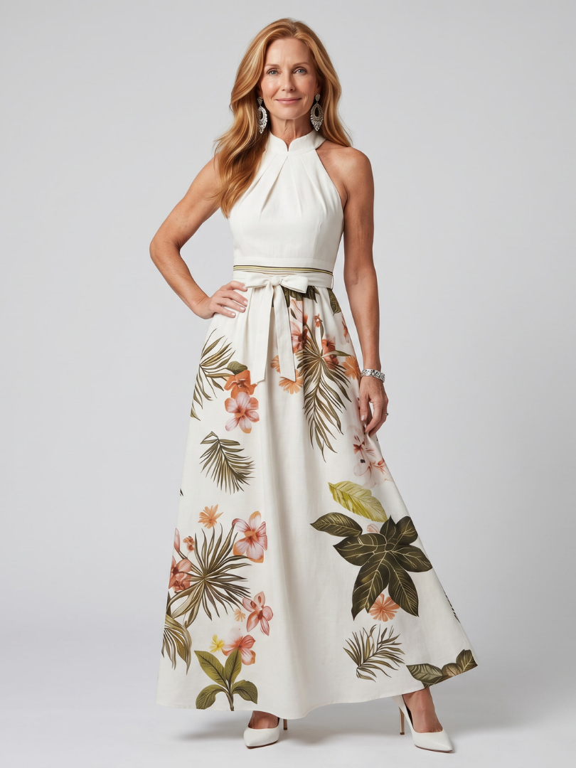 Robe longue Danoir Paris Meadow en blanc avec drapé halter et panneau botanique, style maxi élégant et fluide.
