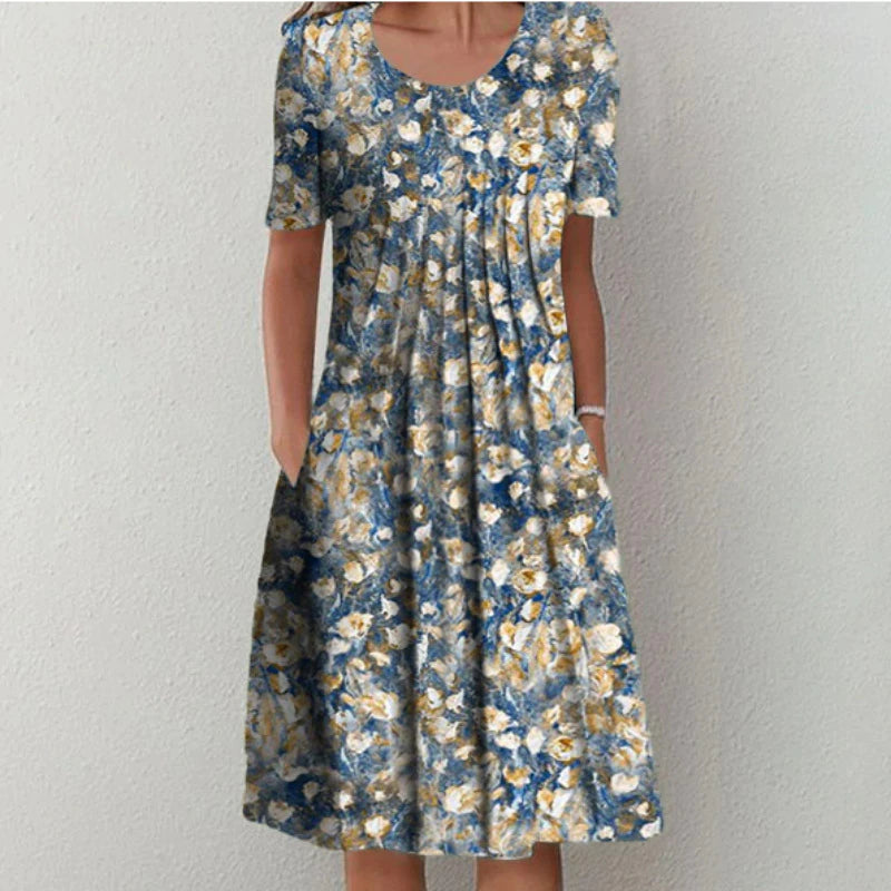 Robe midi aérée élégante Celeste de Danoir Paris pour femmes, motif fleuri multicolore, coupe fluide et féminine.