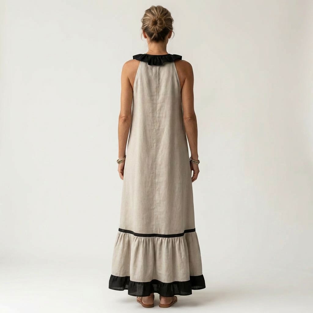 Robe maxi sans manches Danoir Paris avec col volant et détails contrastés, vue de face, élégante et fluide.