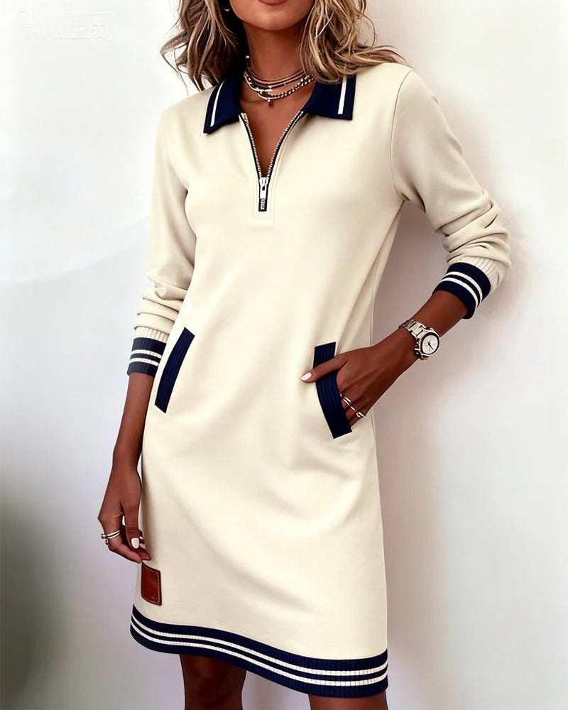 Robe Delia à zip devant avec col en V, marque Danoir Paris, tissu élégant et coupe flatteuse, portée avec accessoires.