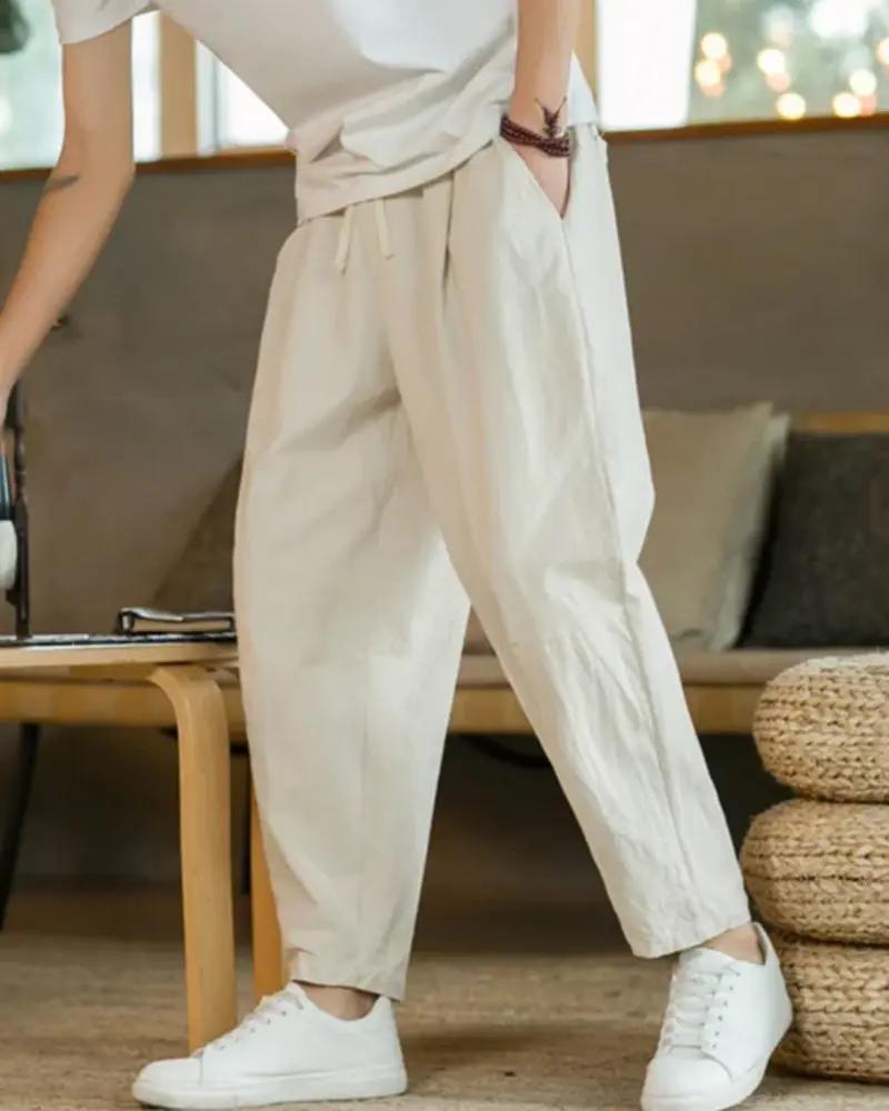 Pantalon en coton beige Old Money Cancun, coupe décontractée, tissu léger, idéal pour un style confortable et élégant.