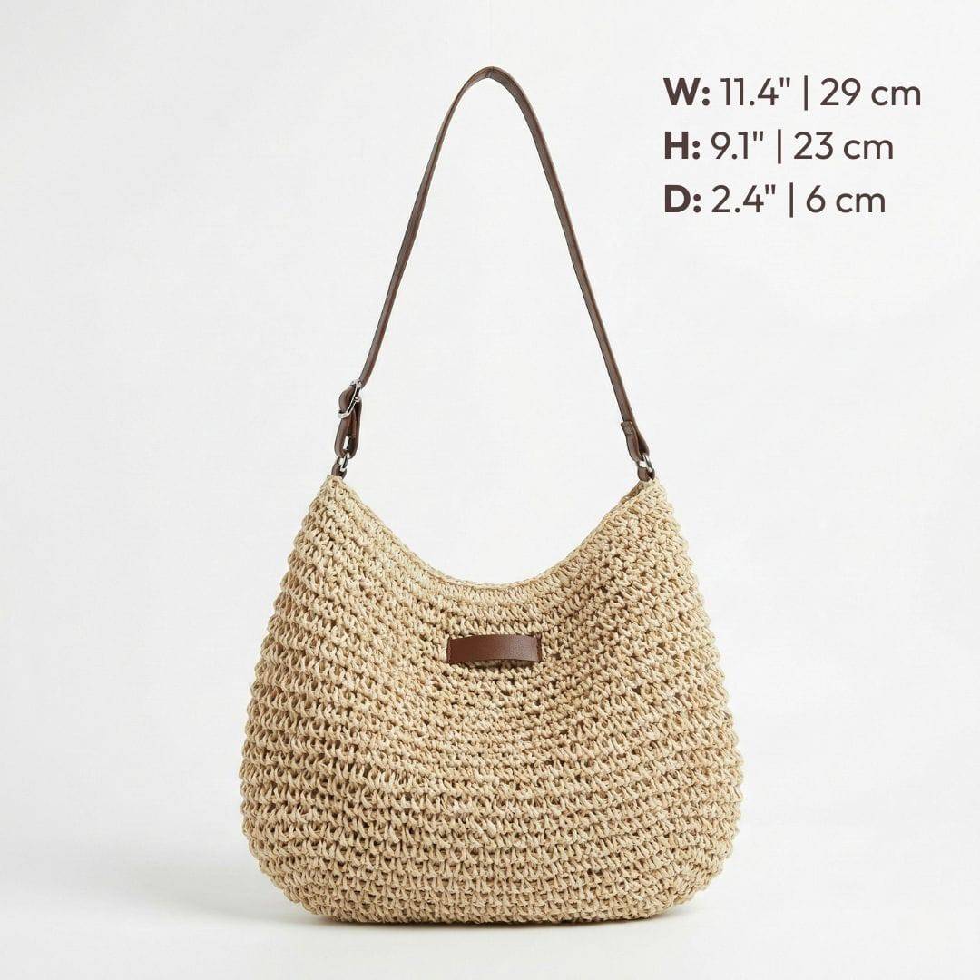 Sac élégant Kathy en cuir noir de Danoir Paris, avec poignée en chaîne et design sophistiqué, posé sur fond neutre.