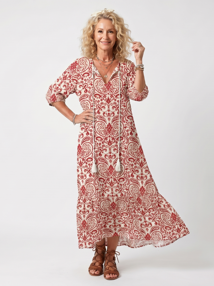 Robe midi Danoir Paris Noelle avec motif ornemental, franges et liens, en tissu fluide et élégant.