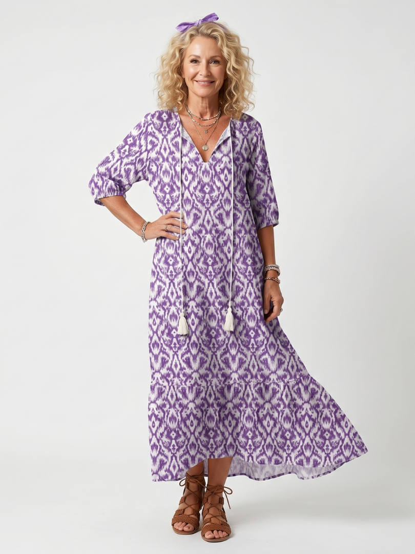 Robe midi à franges Danoir Paris Pénélope avec imprimé à liens, longueur mi-mollet, détails de franges et design élégant.
