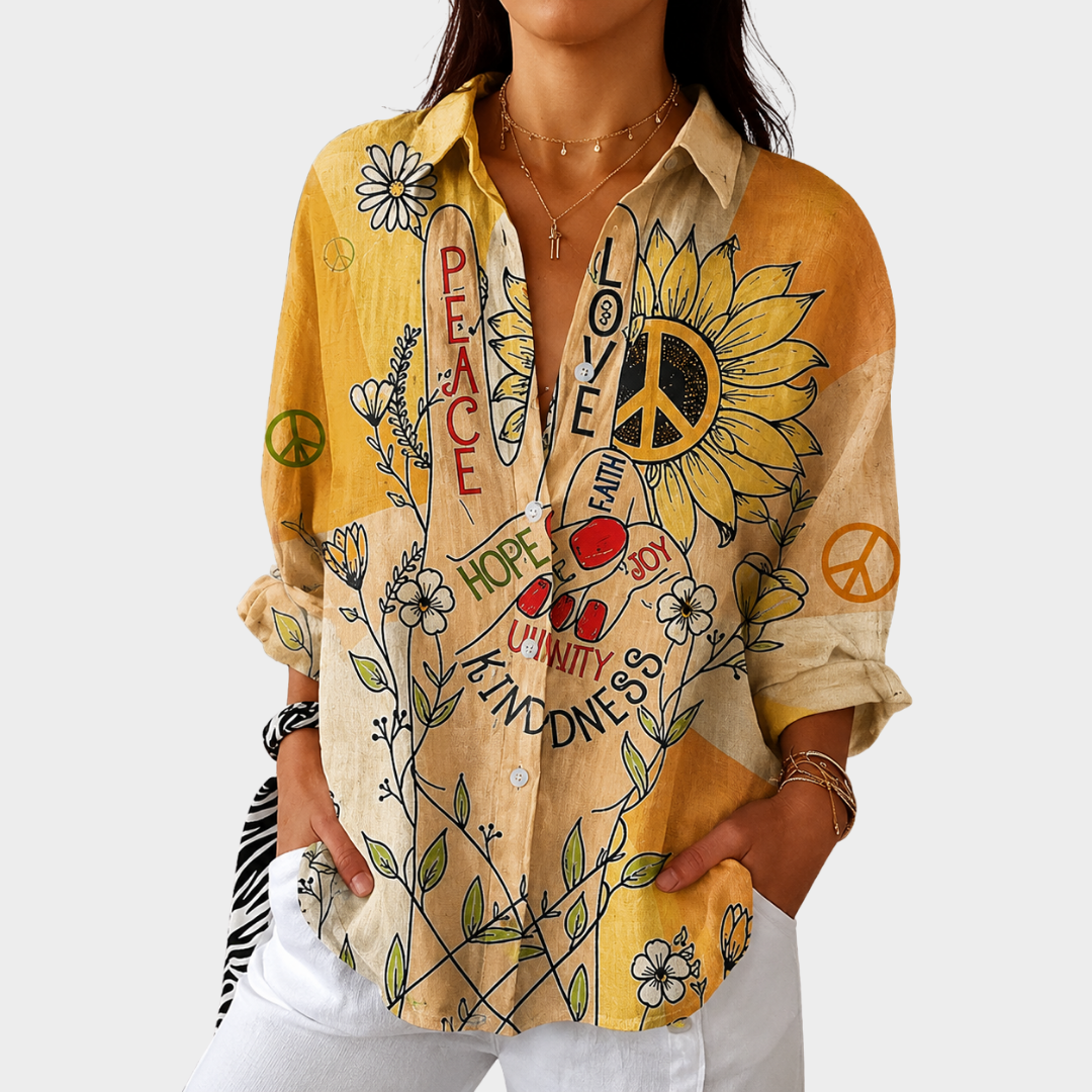 Blouse légère et colorée à imprimé de la marque Danoir Paris, avec un design fluide et vibrant visible sur l'image.