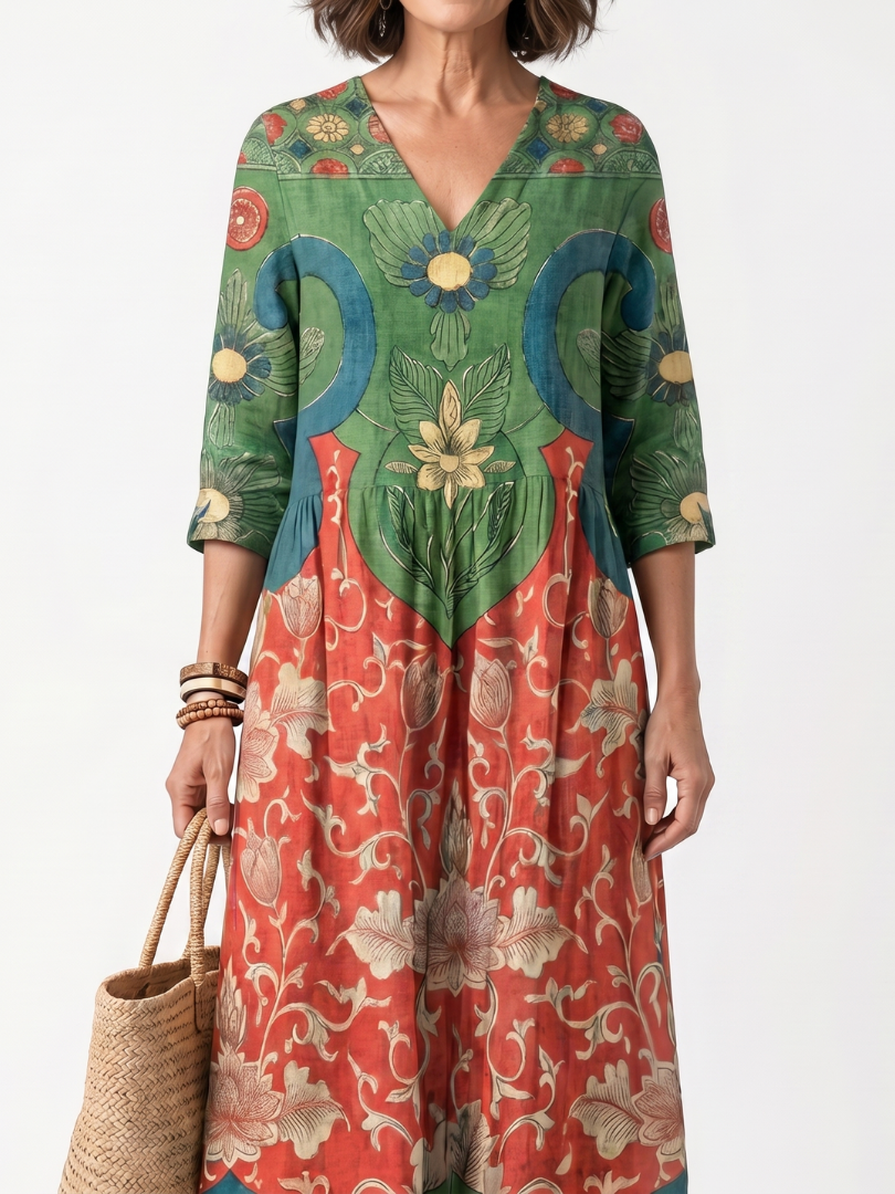 Robe midi Danoir Paris Sloane à imprimé mixte, col en V et poches, portée décontractée et élégante.