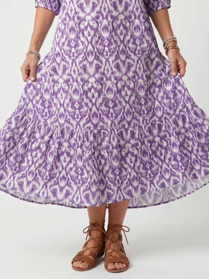 Robe midi à franges avec imprimé à liens de la marque Danoir Paris, visible en détail sur cette image.