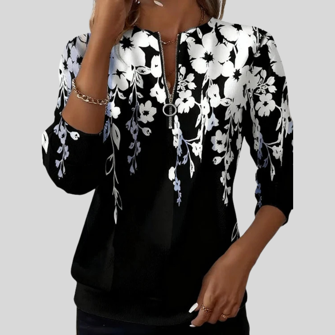Sweat à col zippé floral Danoir Paris Sheila, sweatshirt en tissu doux avec motif floral coloré, portée sur un mannequin.