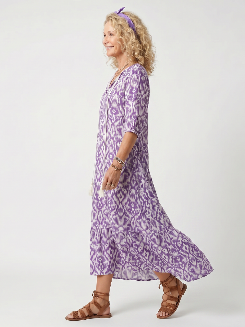 Robe midi à franges avec imprimé à liens de la marque Danoir Paris, visible avec détails de franges et motifs imprimés.