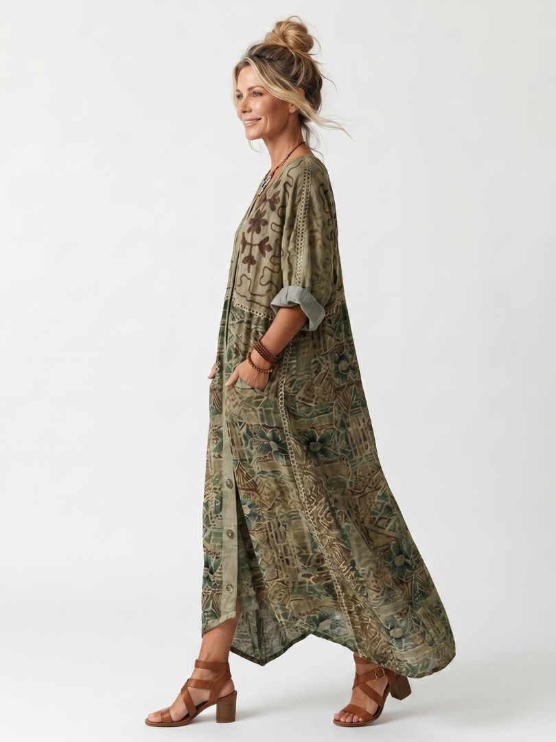 Robe midi oversize Danoir Paris avec poches brodées et fermeture à boutons, tissu fluide et style décontracté.