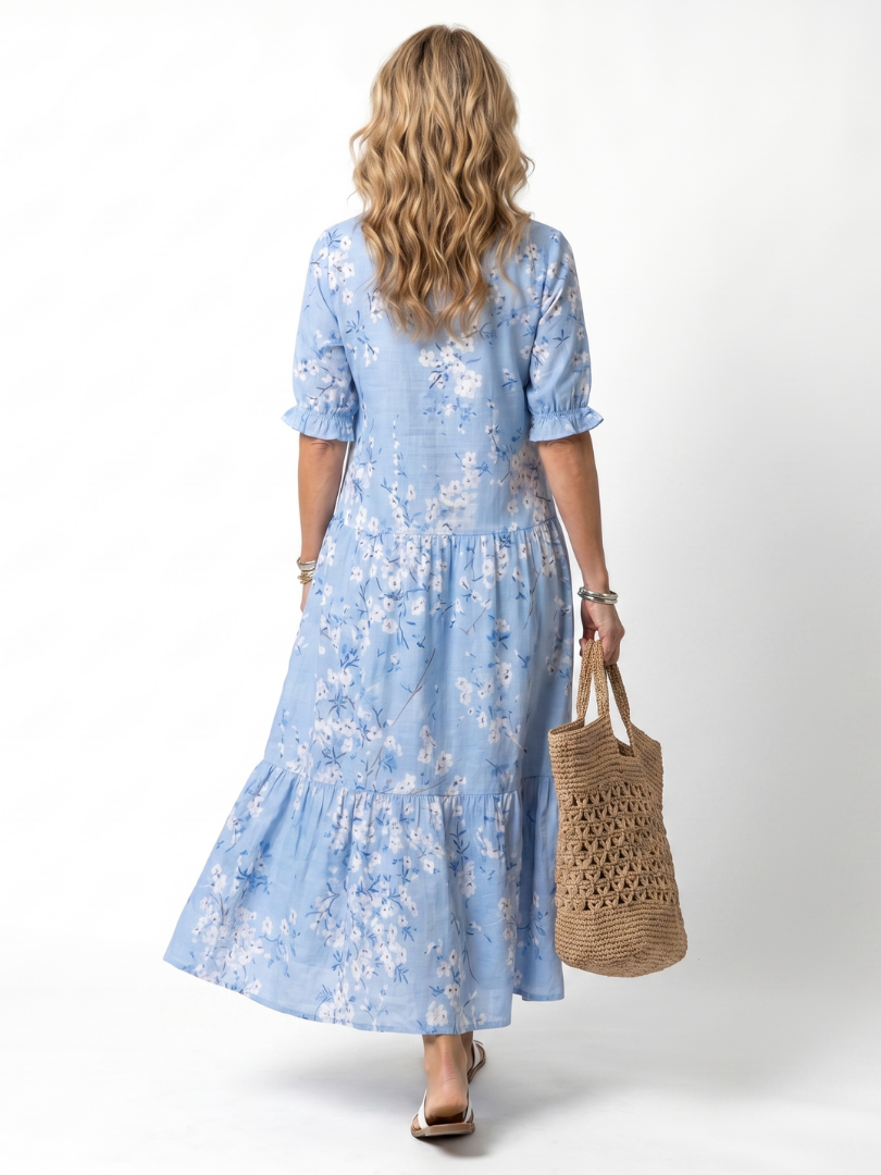 Robe midi florale Danoir Paris Alora avec franges, motif print coloré, manches longues et coupe fluide élégante.