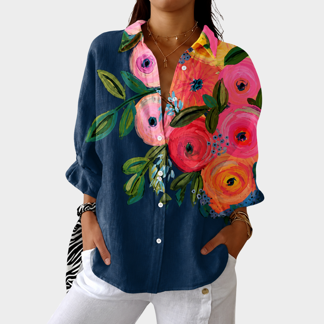 Blouse imprimée colorée et légère de Danoir Paris, avec un motif floral et des manches longues.