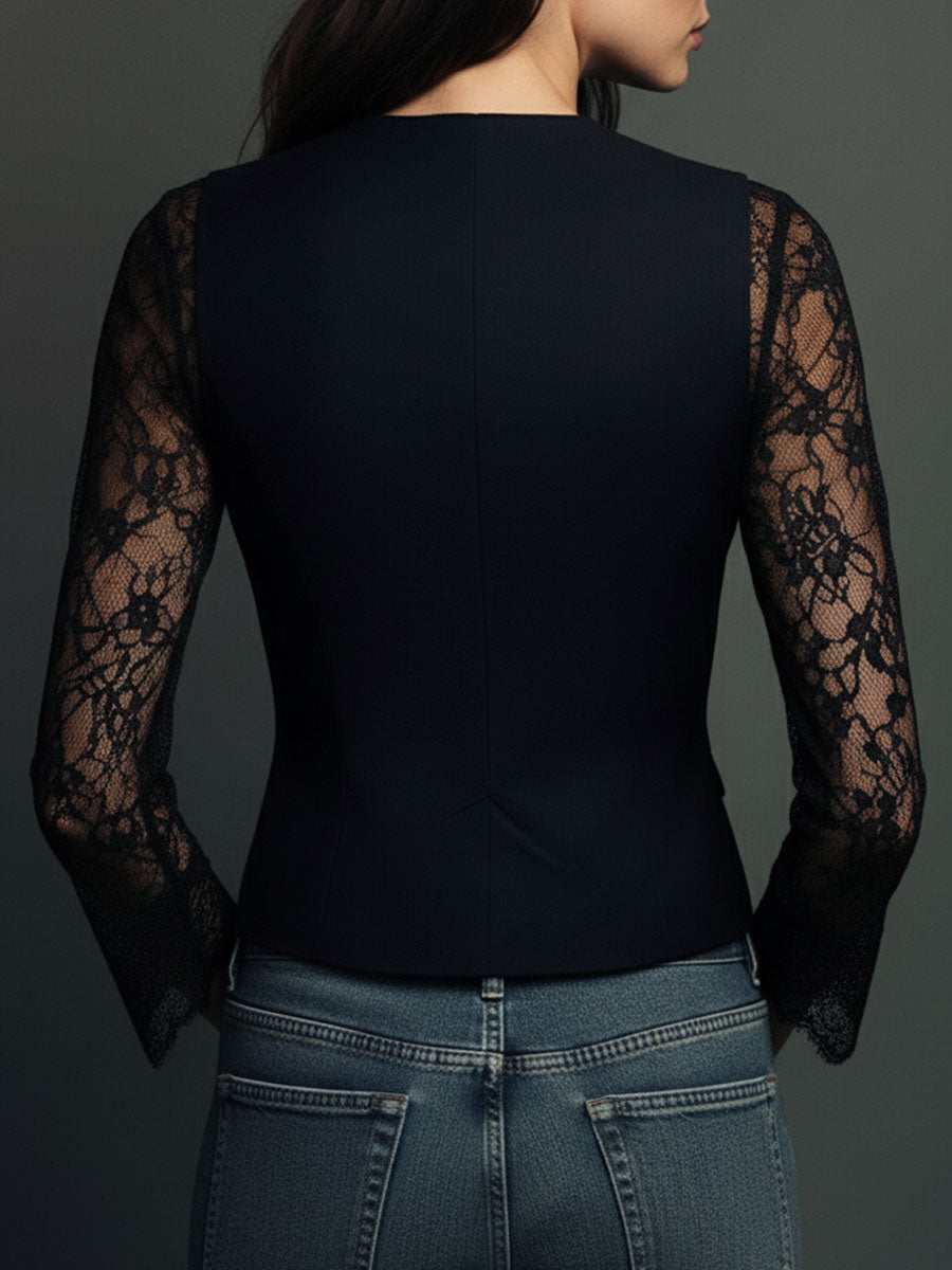 Blazer noir Noémie de Danoir Paris avec manches semi-transparentes, coupe élégante et détails modernes.