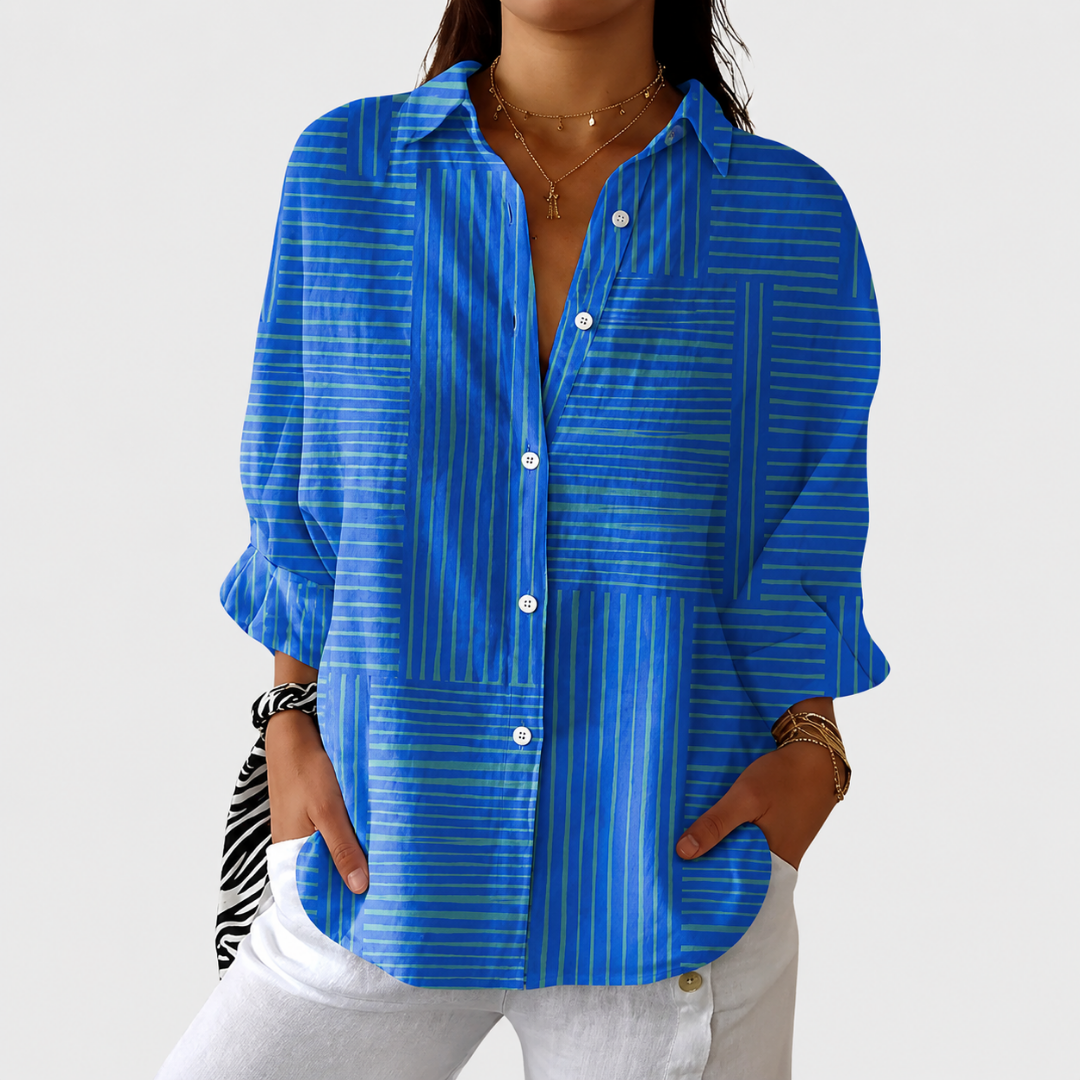Blouse colorée et imprimée de la marque Danoir Paris, léger tissu avec motif floral, portée élégante et printanière.