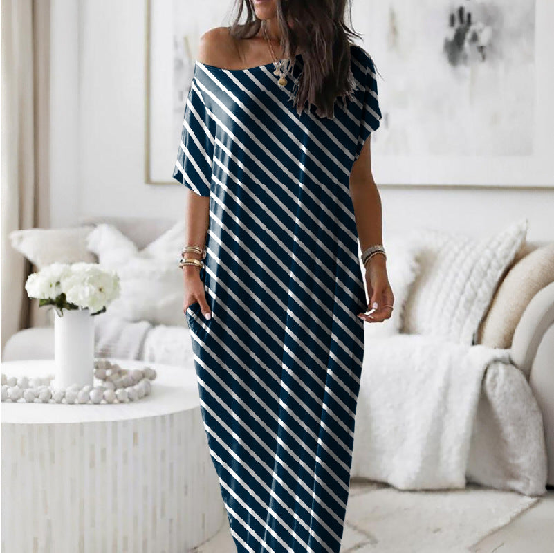 Robe décontractée oversize asymétrique à épaules dénudées de Danoir Paris, en tissu fluide et léger.