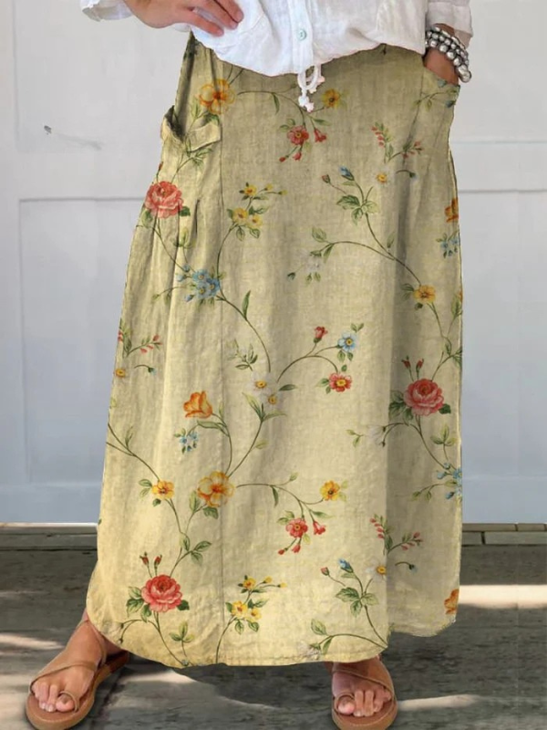 Jupe portefeuille élégante Mella™ de Danoir Paris avec motifs floraux rétro, taille élastique et poches, style chic et féminin.
