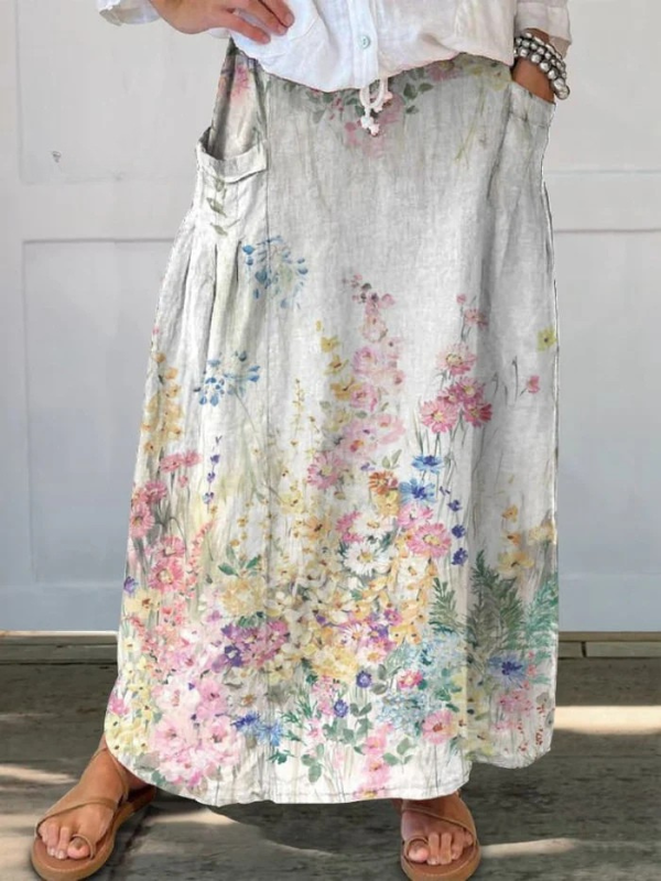 Jupe portefeuille élégante à fleurs rétro Mella™ de Danoir Paris avec taille élastique et poches, style floral vintage.