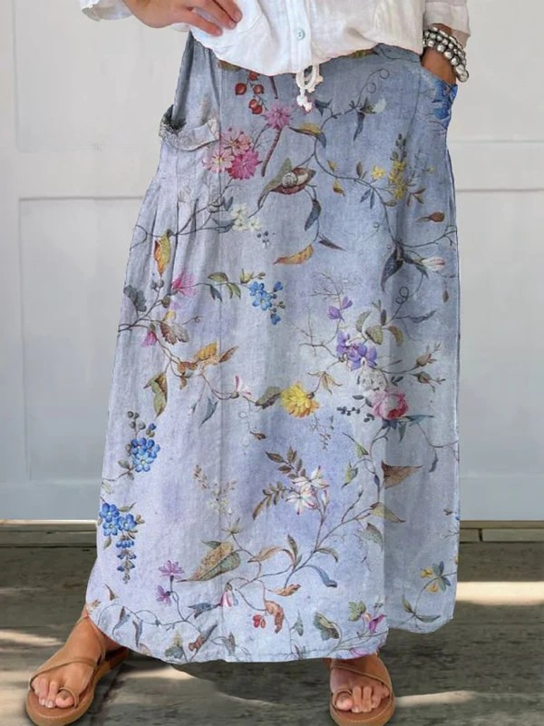 Jupe vintage élégante à poches Jeda™ Danoir Paris avec motif bleu, style sophistiqué et coupe flatteuse visible dans l'image.