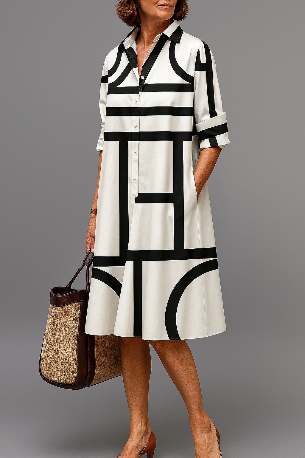Robe midi élégante Danoir Paris Elua en blanc et noir, tissu soigné, style sophistiqué et moderne.