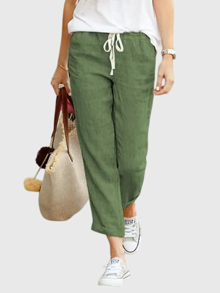 Pantalons d'été élégants Zanra™ de Danoir Paris en tissu léger couleur abricot, mode chic pour la saison estivale.