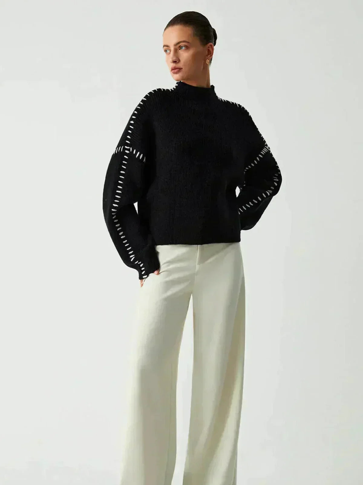 Pull confortable Danoir Paris Nia pour l'automne, en tissu doux noir, mode décontractée et élégante.