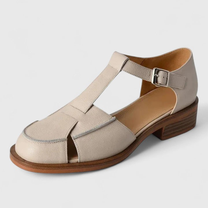 Faustine™ Danoir Paris, bébé découpes latérales en beige, design doux et confortable pour bébé.