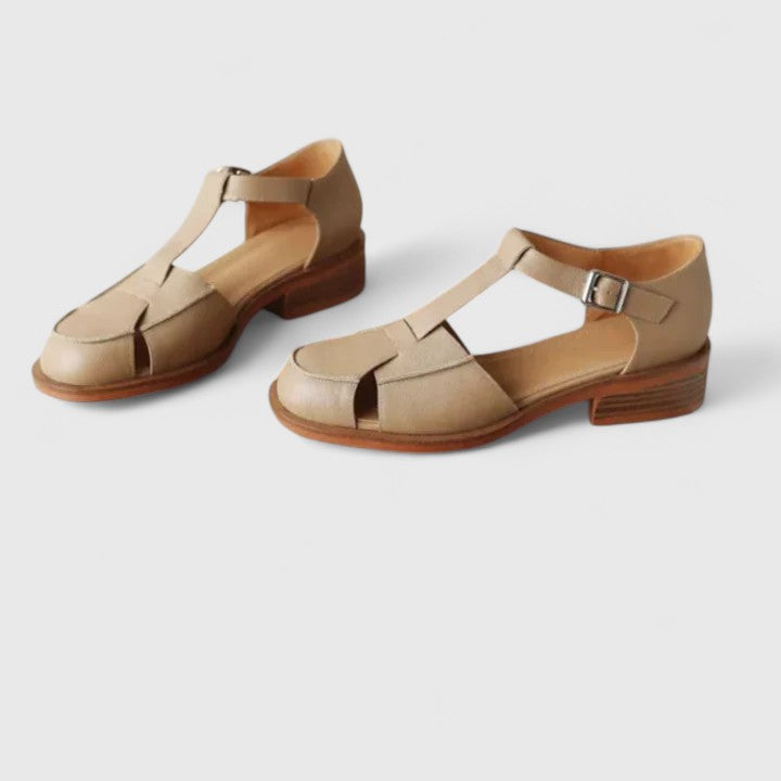 Faustine™ Danoir Paris, bébé découpes latérales en beige, détail de design élégant et confortable pour bébé.
