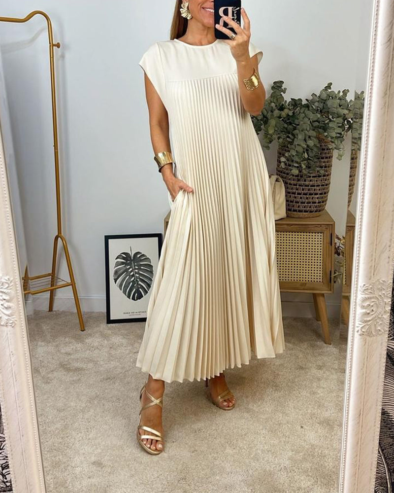 Robe longue beige élégante Sylvie de Danoir Paris, vue de face avec détails de tissu fluide et coupe sophistiquée.