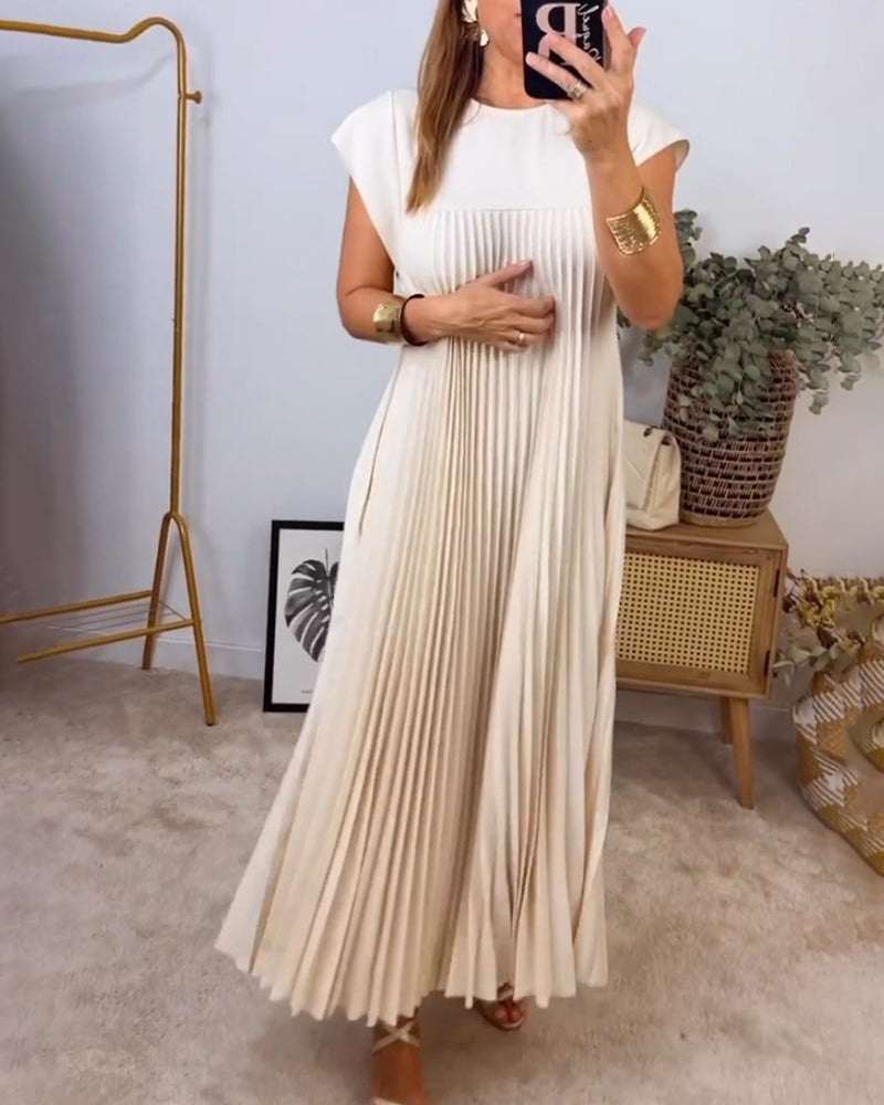 Robe longue élégante Sylvie de Danoir Paris en beige, vue de face, tissu fluide et style sophistiqué.