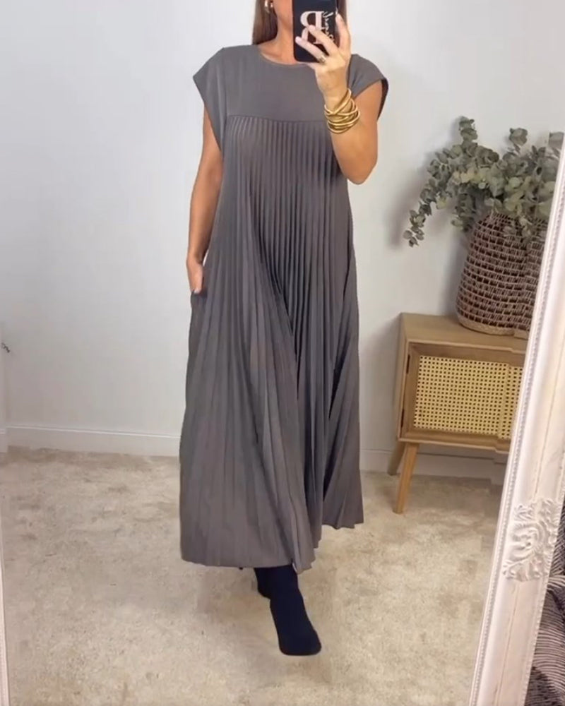 Robe longue élégante Sylvie de Danoir Paris en tissu beige, avec coupe fluide et détails sophistiqués.