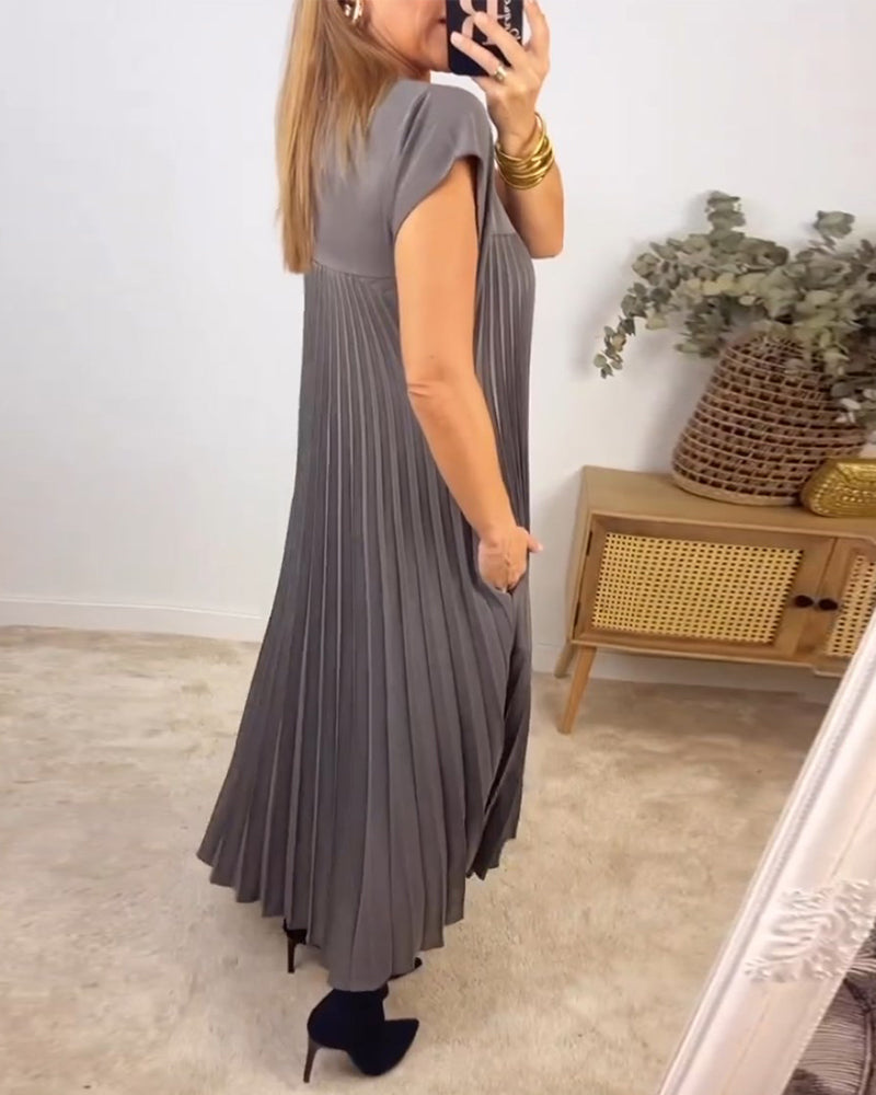 Robe longue élégante Sylvie de Danoir Paris en beige, vue de face, tissu fluide et silhouette sophistiquée visible sur l'image.