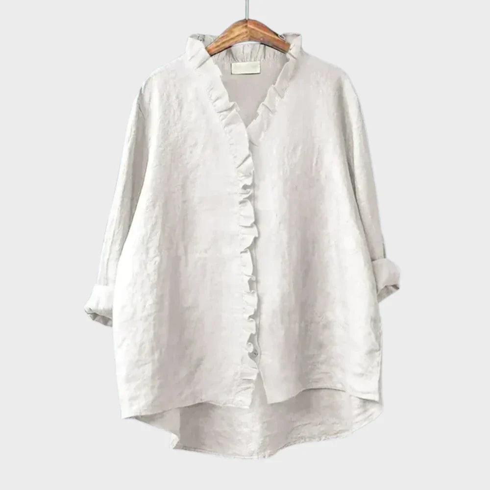 Blouse d'été élégante en lin Eline de Danoir Paris, vêtement léger blanc avec manches courtes et design raffiné.