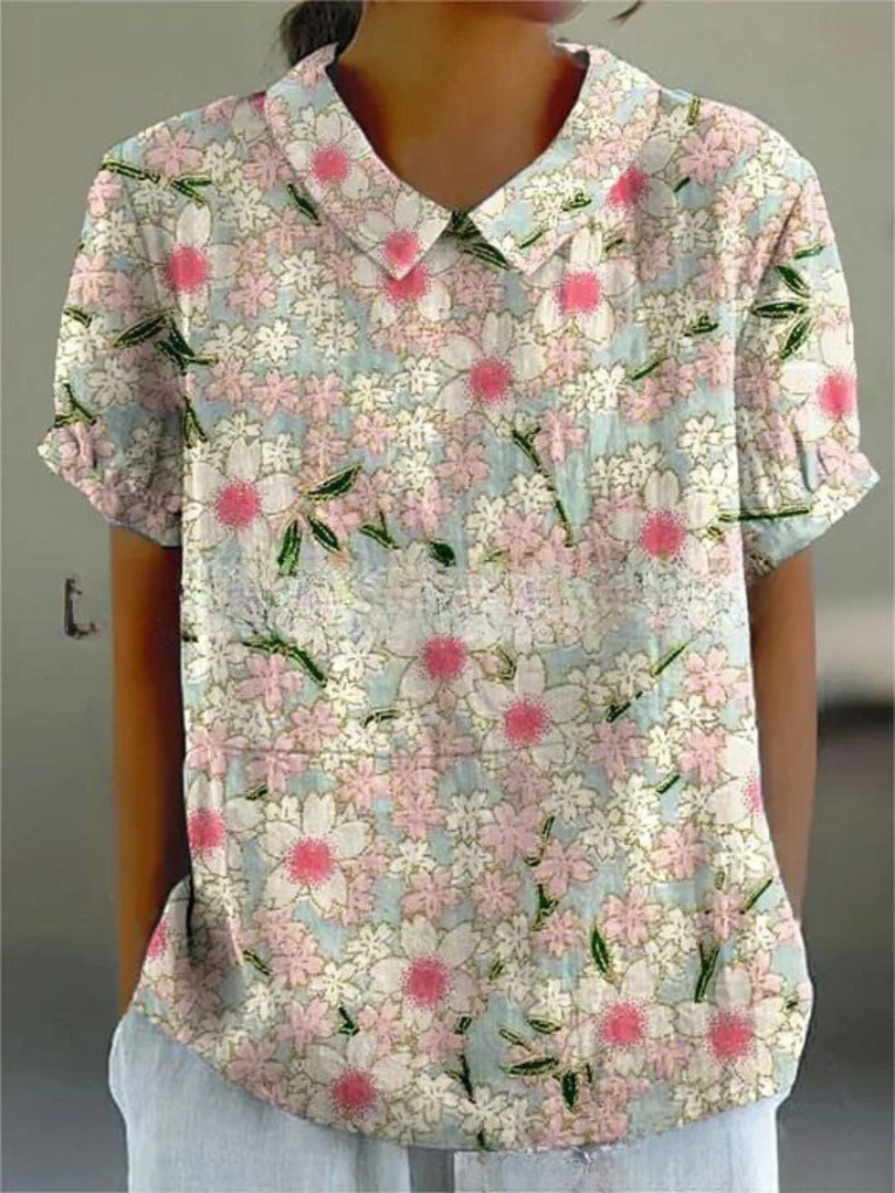 Chemise fleurie élégante Sofia de Danoir Paris, tissu blanc avec motifs floraux, vue de face sur mannequin.