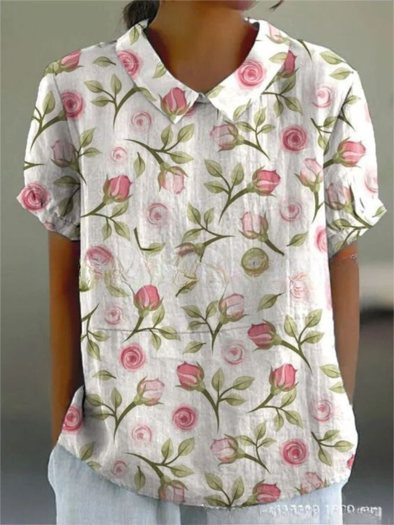 Chemise fleurie élégante Sofia de Danoir Paris, tissu blanc avec motif floral, détail de col et manches.