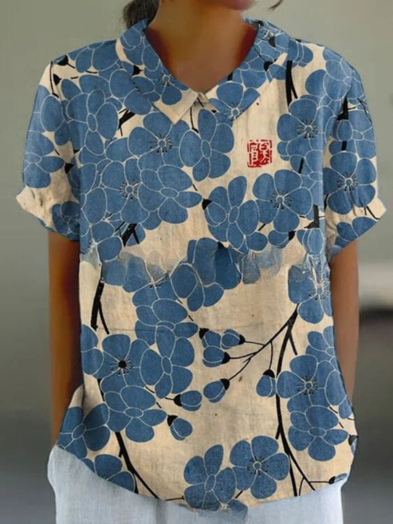 Chemise fleurie élégante Sofia de Danoir Paris, tissu blanc avec motifs floraux, vue de face sur fond neutre.
