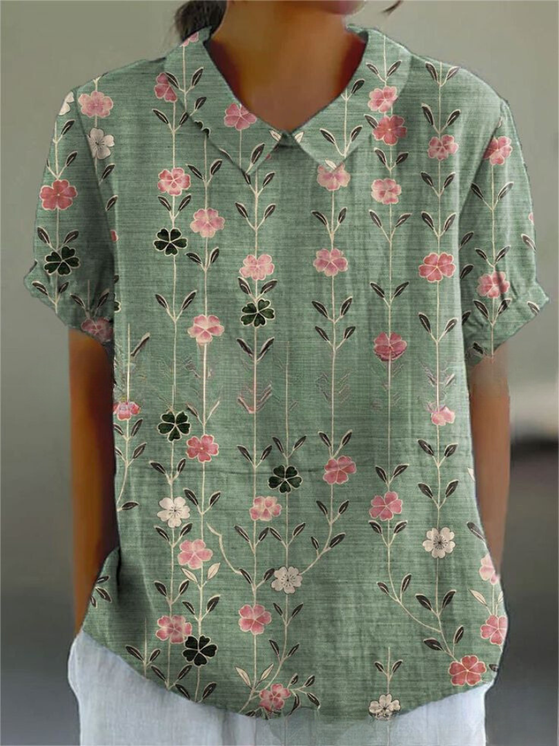 Chemise fleurie élégante Sofia de Danoir Paris, tissu blanc avec motif floral, style féminin et sophistiqué.