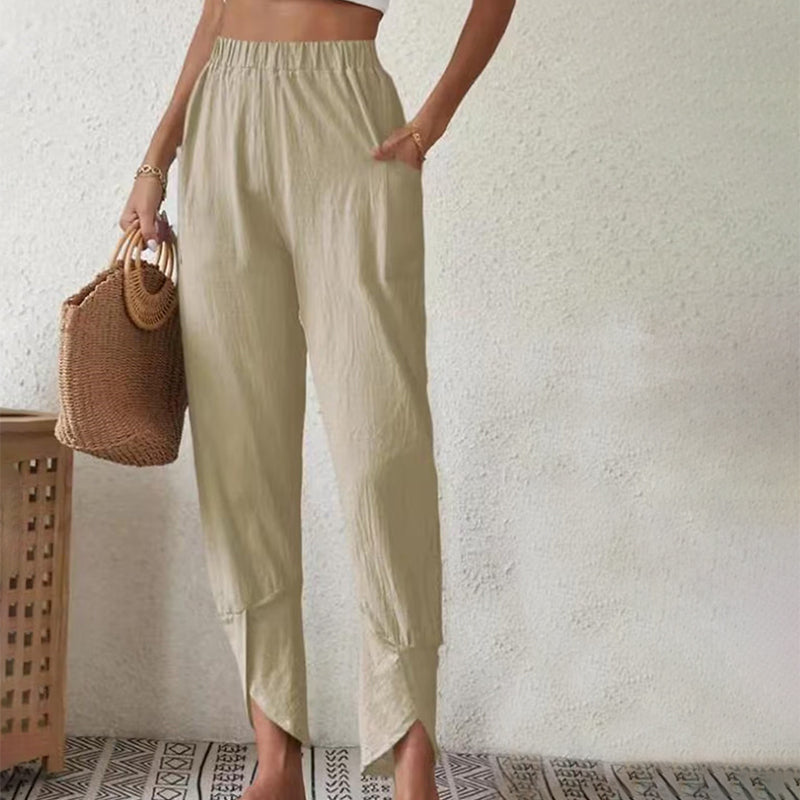 Pantalons Essari à ourlet effiloché Danoir Paris en tissu blanc, vue de face avec détails du style décontracté.