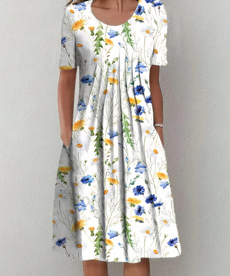 Robe florale élégante Danoir Paris pour femme, motif blanc et rouge, tissu léger et fluide.