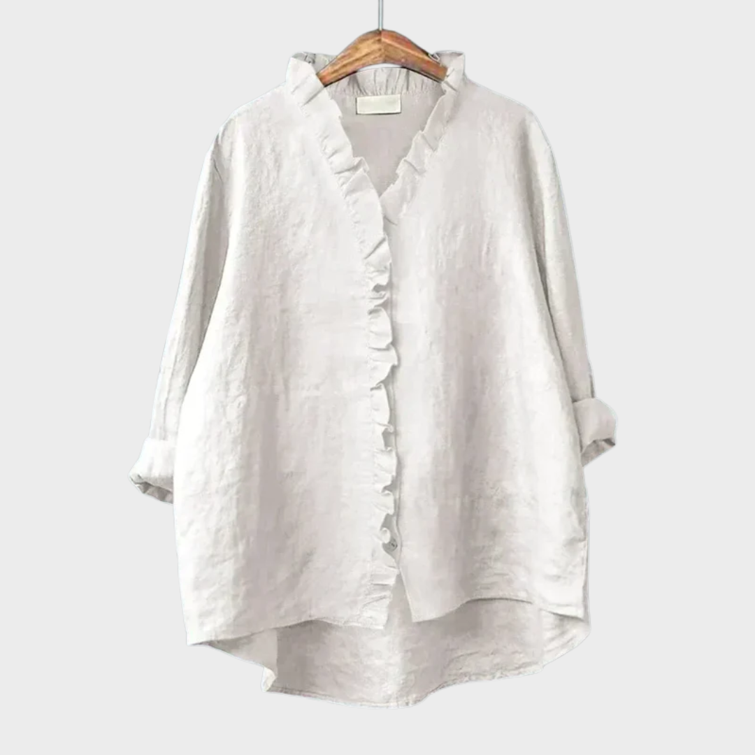Blouse blanche Danoir Paris Célestine avec volants délicats, tissu léger et détails élégants pour un style féminin sophistiqué.