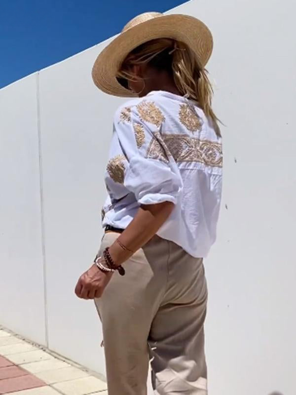 Chemisier élégant Danoir Paris Erisa en blanc, adapté pour diverses occasions, avec un design sophistiqué et moderne.
