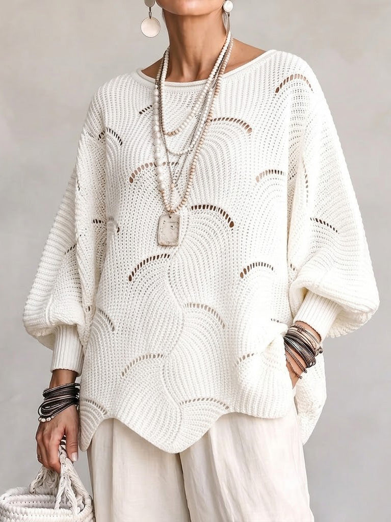 Haut en tricot blanc Danoir Paris avec manches lanternes amples et motif en vagues creuses, vue de face.