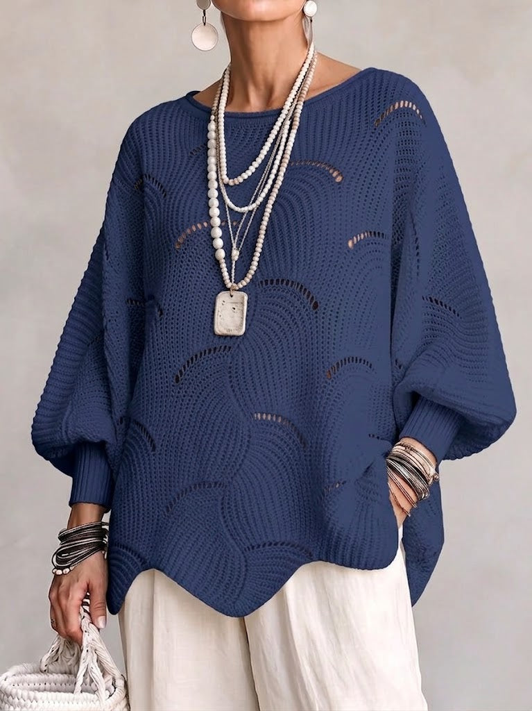 Haut en tricot blanc Danoir Paris à manches lanternes amples avec motif en vagues creuses, visible en détail.