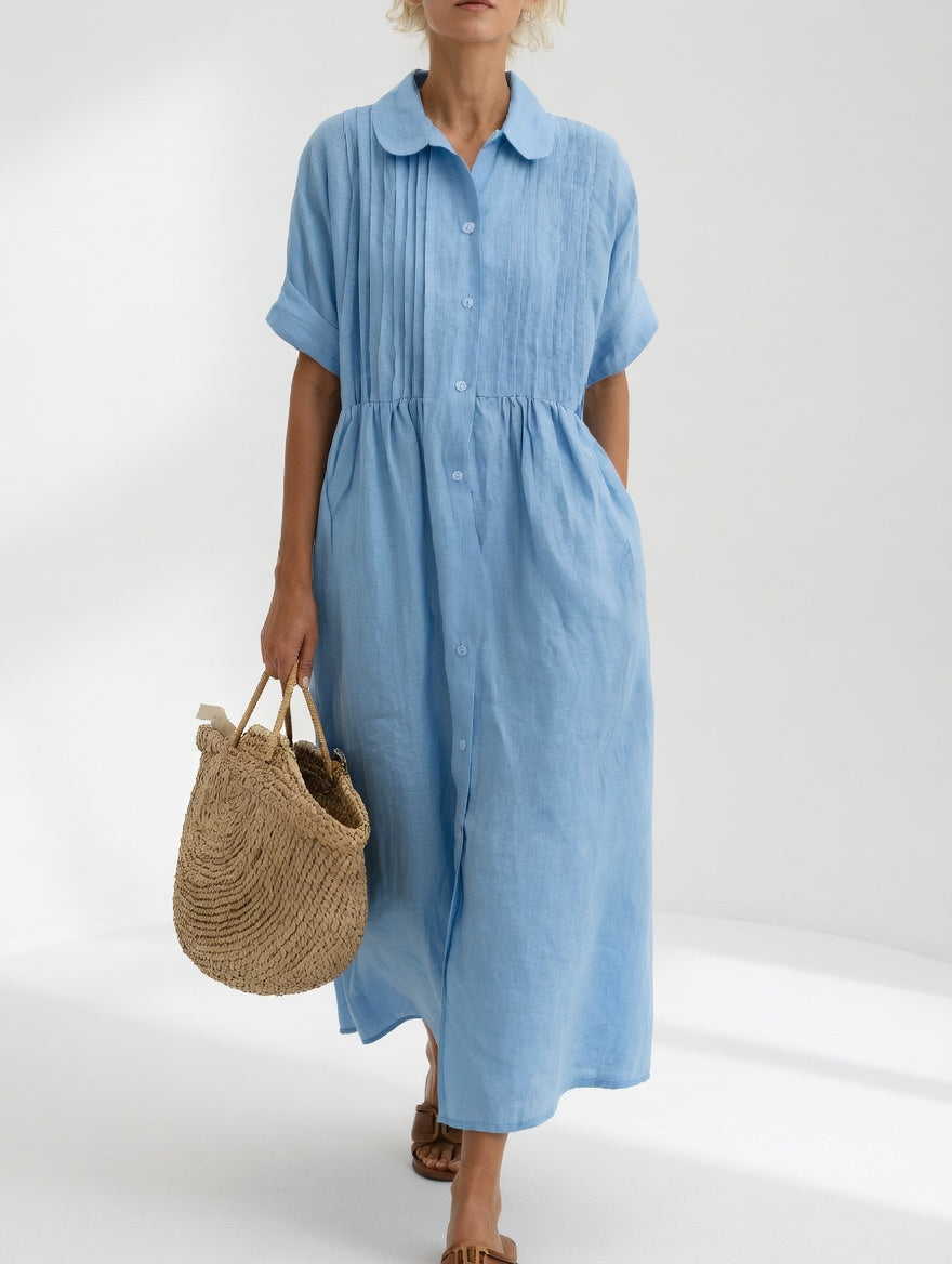 Robe chemise fluide d'été Lysandra™ de Danoir Paris, tissu léger blanc avec détails élégants et coupe confortable.