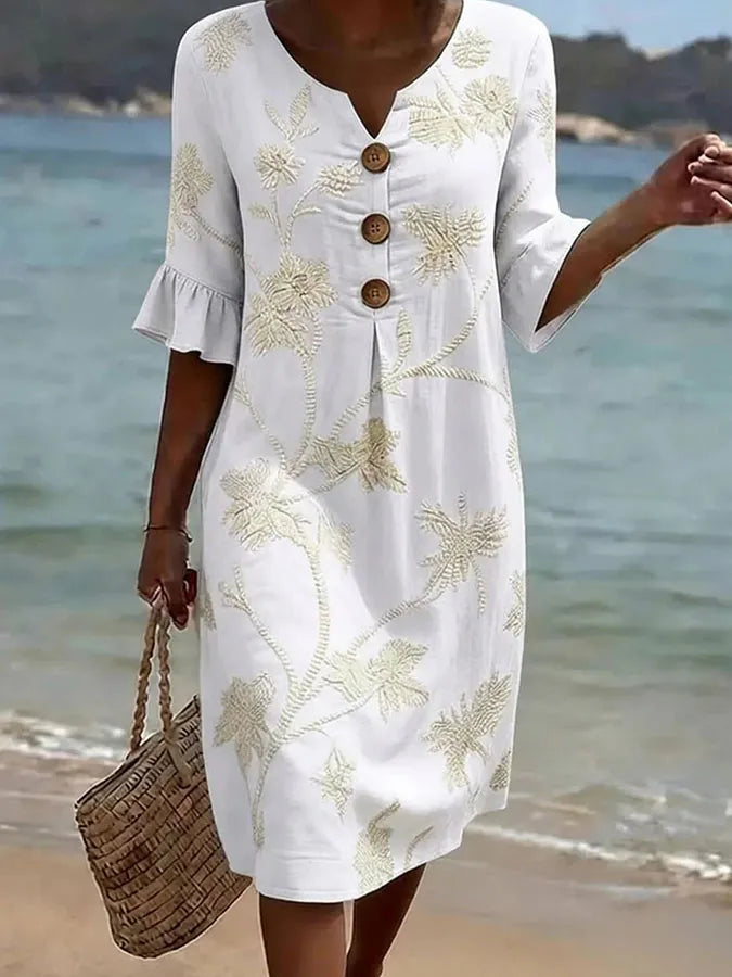 Robuste robe décontractée pour femme Danoir Paris avec imprimé floral blanc, tissu léger et style élégant.